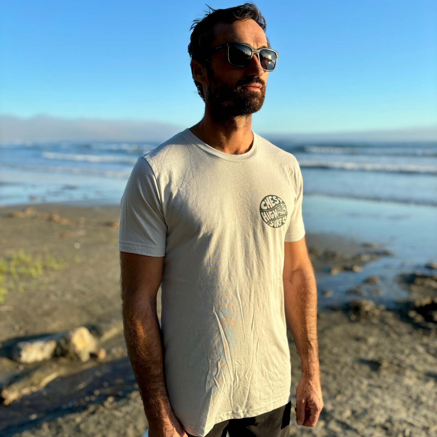 Surfer wearing a Chest High graphic tee on the West Coast. 