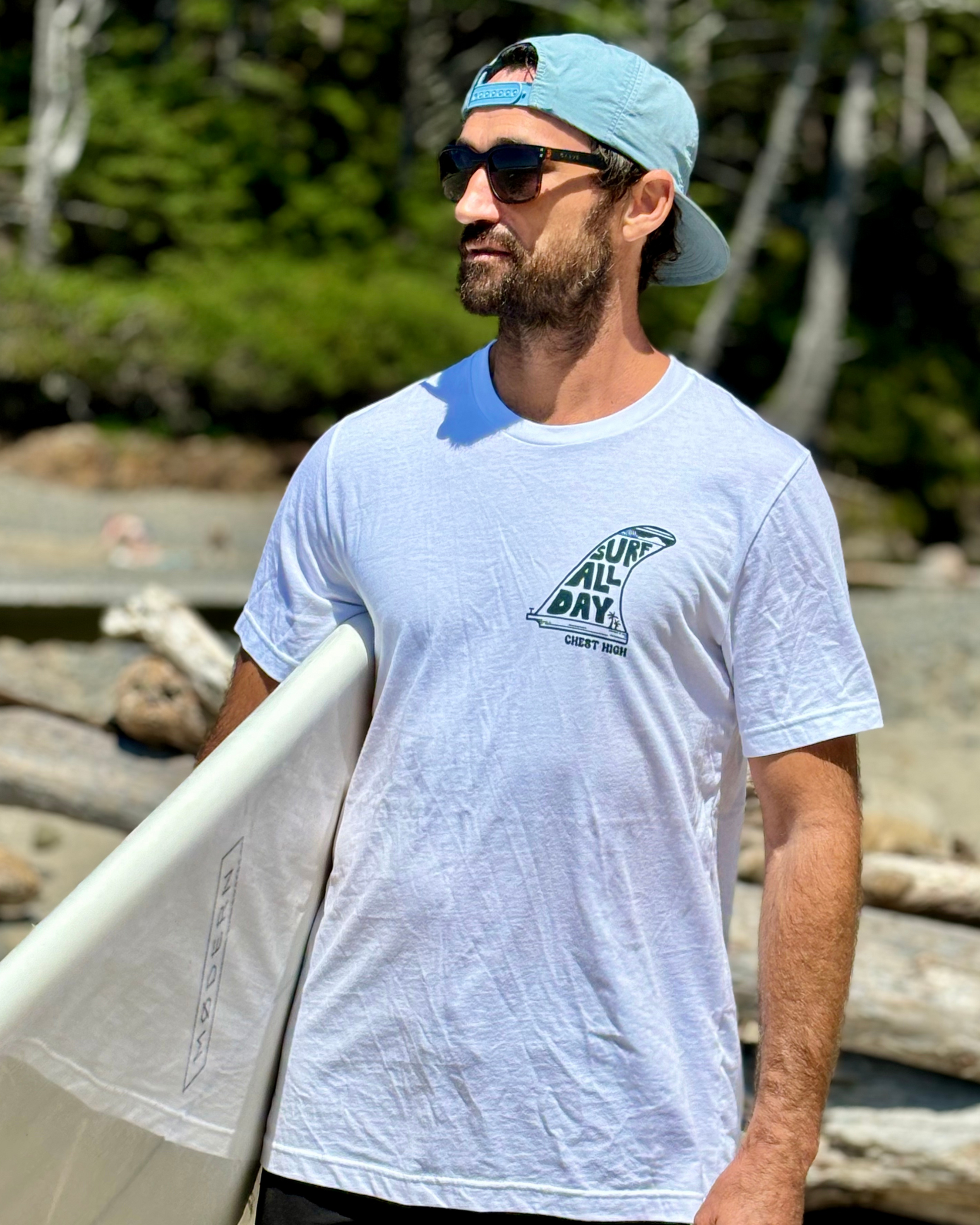 Surfer wearing a single fin graphic tee on the West Coast. 